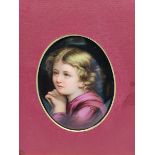 Continental oval porcelain plaque painted with a head and shoulders portrait of a child and inscribe