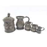 19th Century pewter tobacco jar and cover of cylindrical design cast with scenes from Mr Punch H17cm