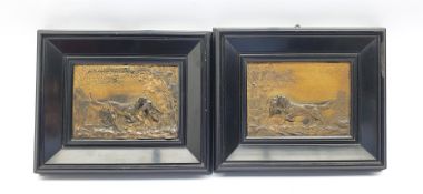 Pair of relief cast metal plaques modelled as hunting dogs in landscapes, in ebonised frames, 125cm