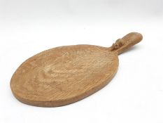 Thompson of Kilburn Mouseman oak cheese board of oval design, the raised handle with carved mouse si