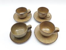 Mick Arnup (British 1923-2008): Series of four cups and saucers fired in a large oil-fired kiln with