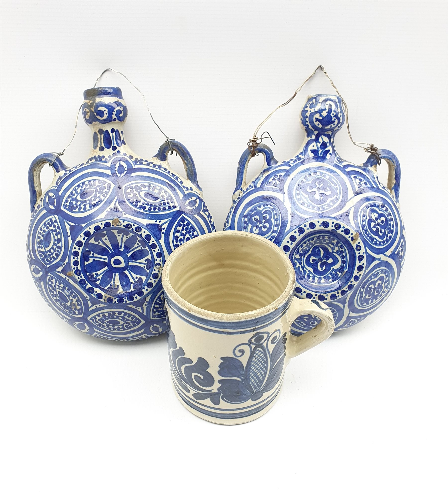 Pair of Moorish pottery flasks decorated in blue and white D18cm and a Continental blue and white mu