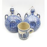 Pair of Moorish pottery flasks decorated in blue and white D18cm and a Continental blue and white mu