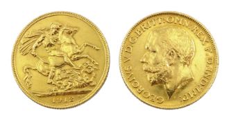 Two gold presentation medallions formed from one gold full sovereign
