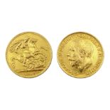 Two gold presentation medallions formed from one gold full sovereign