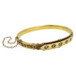 Early 20th century 15ct gold five stone diamond set bangle, Birmingham 1915