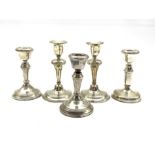 Pair of silver dressing table candlesticks Birmingham 1918 H13cm, a smaller pair H11cm and a similar