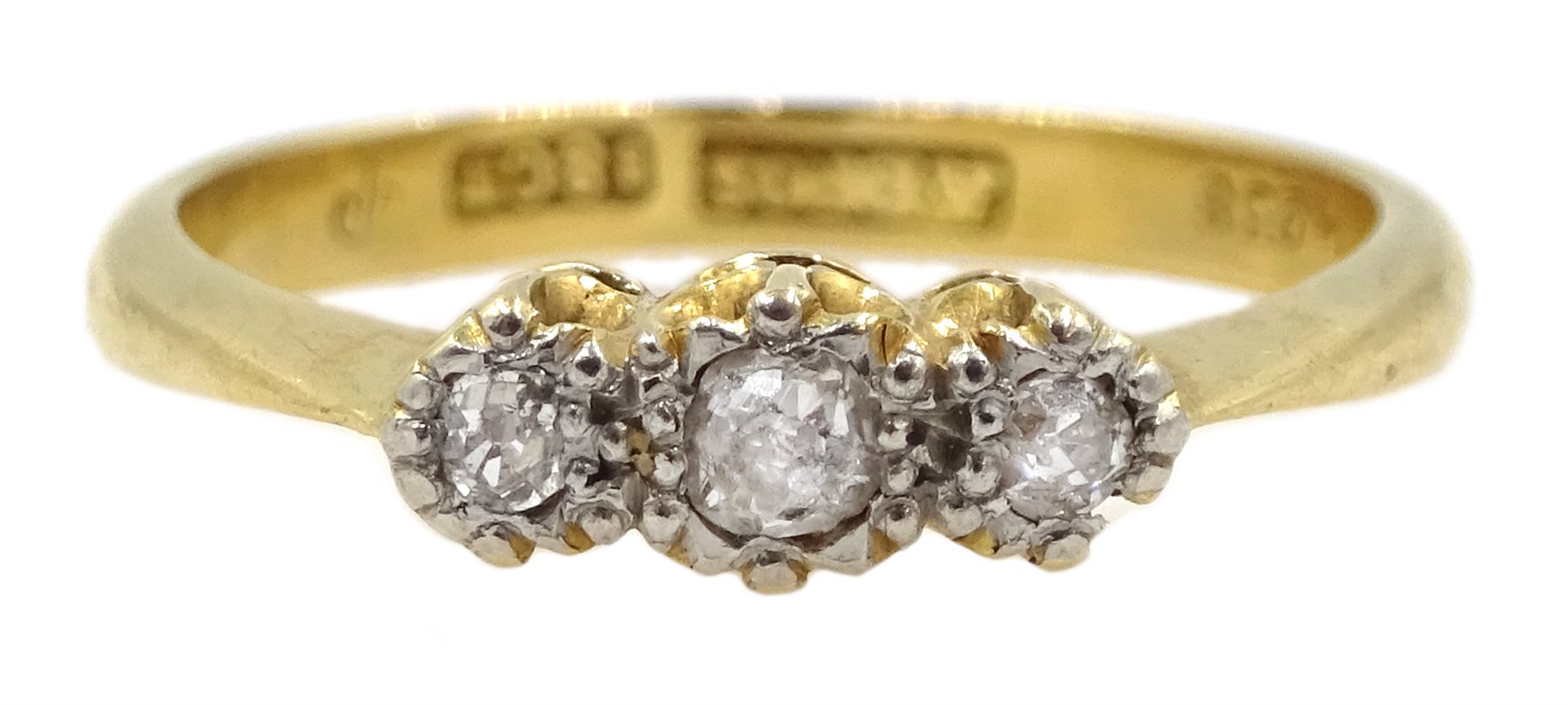 Gold three stone diamond ring, illusion set, stamped 18ct
