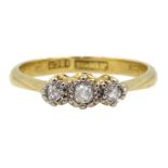 Gold three stone diamond ring, illusion set, stamped 18ct