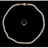 Single strand cultured pearl necklace, with gold clasp stamped 14K and a 9ct gold single stone diamo