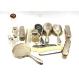 Various silver mounted dressing table items including hair and clothes brushes and combs, and a numb