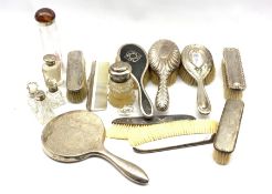 Various silver mounted dressing table items including hair and clothes brushes and combs, and a numb