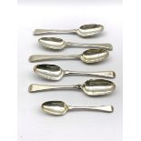 Five late 18th Century silver feather and bead edge table spoons engraved with a crest and a similar