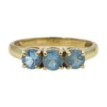 9ct gold three stone blue topaz ring, hallmarked