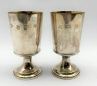 Pair of silver limited edition goblets with gilded interiors commemorating the thirteen hundredth an