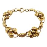 Gold flower and leaf link bracelet, stamped Regal 10K, approx 9.2gm