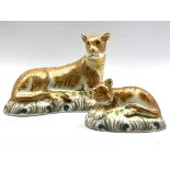 Royal Crown Derby 'Lioness' paperweight and another 'Lion Cub', both boxed and with gold stoppers