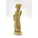 Japanese Meiji carved ivory Okimono of a Bijin, Tokyo School, standing wearing elaborately decorated