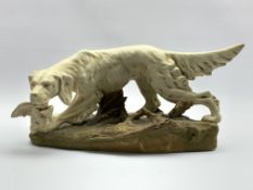 Royal Dux figure of a dog with pheasant, pink triangular mark to base, H19cm, L40cm