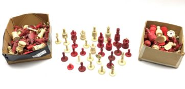 Collection of 19th century turned ivory and bone chess pieces in plain and red stained, incomplete s