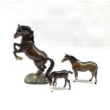 Beswick model of a rearing Welsh cob, first version No.1014, Beswick brown foal No. 2839 and one oth