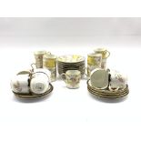 Nine Selb Bavarian coffee cans and ten saucers with floral sprays on a yellow and gilt ground and