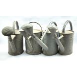 Set of four Galvanised watering cans, H43cm max