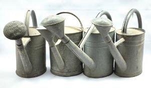 Set of four Galvanised watering cans, H43cm max