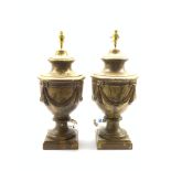 Pair of modern pottery table lamps, of urn form, relief moulded with gilt swags against a gilt groun