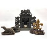 Victorian cast iron miniature fire place, crested by the Royal coat of arms and flanked by fruiting