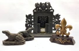 Victorian cast iron miniature fire place, crested by the Royal coat of arms and flanked by fruiting