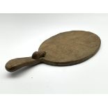 Thompson of Kilburn Mouseman oak oval cheese board, the raised handle with a carved mouse signature
