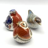Royal Crown Derby 'Black Cap Warbler' paperweight, another 'Royal Robin' and another 'Platinum Robin