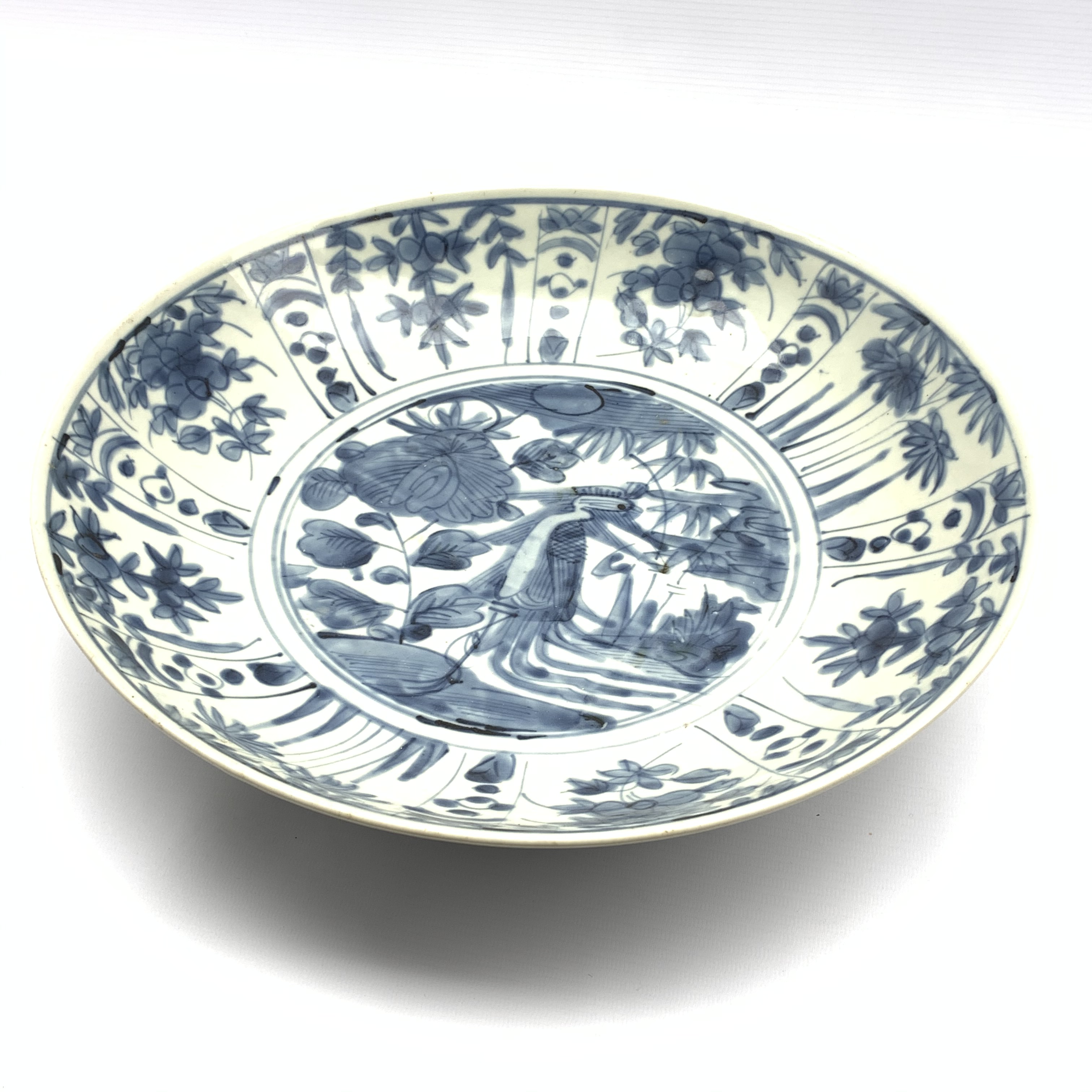 Chinese provincial charger decorated with flowers, foliage etc in blue and white D36cm