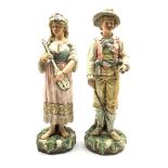 Pair of Continental Pottery standing figures of male and female musicians on naturalistic bases H50c