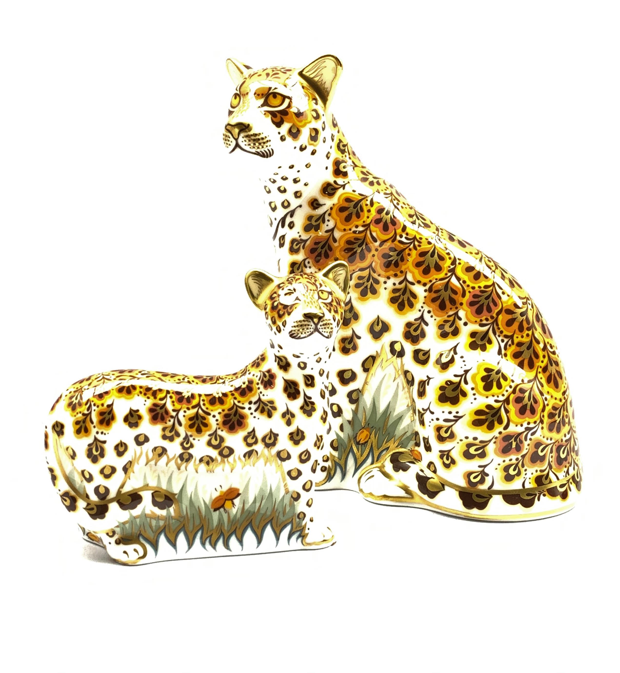 Royal Crown Derby 'Leopardess' paperweight and another 'Leopard Cub', both boxed and with gold stopp