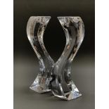 Pair of Rogaska Slovenia art glass candlesticks of serpentine form H27cm