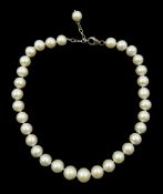 Single strand pearl necklace, each pearl approx 12mm, with silver clasp stamped 925