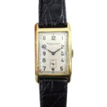 International Watch Co Schaffhausen 14ct gold 'curvex' wristwatch, c.1929, silvered dial, the hinged