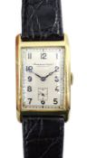 International Watch Co Schaffhausen 14ct gold 'curvex' wristwatch, c.1929, silvered dial, the hinged