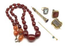 Amber bead necklace L46cm, pinchbeck fob seal, 19th century mourning brooch with hair panel, gilt me