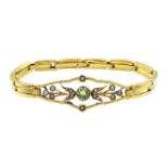 Early 20th century gold peridot and split seed pearl bracelet, on expanding strap, stamped 9ct