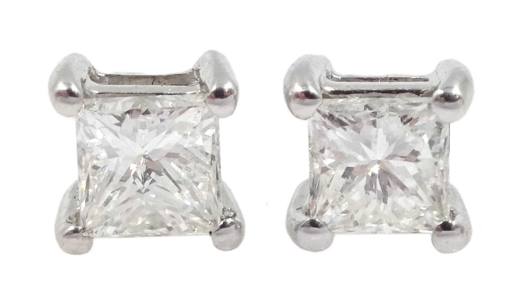 Pair of 18ct white gold princess cut diamond stud earrings, stamped 750, total diamond weight approx
