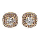 Pair of 18ct gold diamond cluster stud earrings, stamped 750, each central diamond approx 0.50 carat