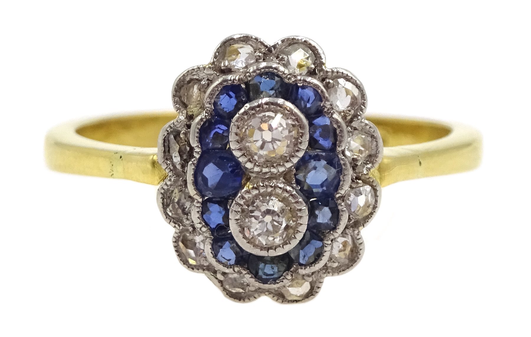 18ct gold milgrain set old cut diamond and sapphire ring, two central diamonds, with a surround of s