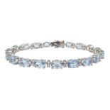 18ct white gold oval aquamarine and diamond bracelet, hallmarked, total aquamarine weight 12.00 cara