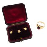 Gold garnet signet ring stamped 9ct and three Victorian gold shirt studs, Birmingham 1898, in silk a