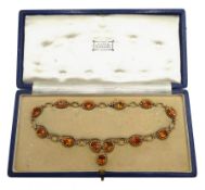 Mid 20th century 9ct gold oval citrine rope and knot design link necklace, retailed by Batty, 25 Kin