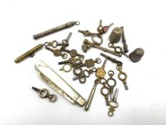 Number of pocket watch keys, pinchbeck seal, miniature silver seal top propelling pencil, other penc