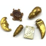 Six novelty vesta cases comprising embossed brass man in the moon, another in the form of a tigers